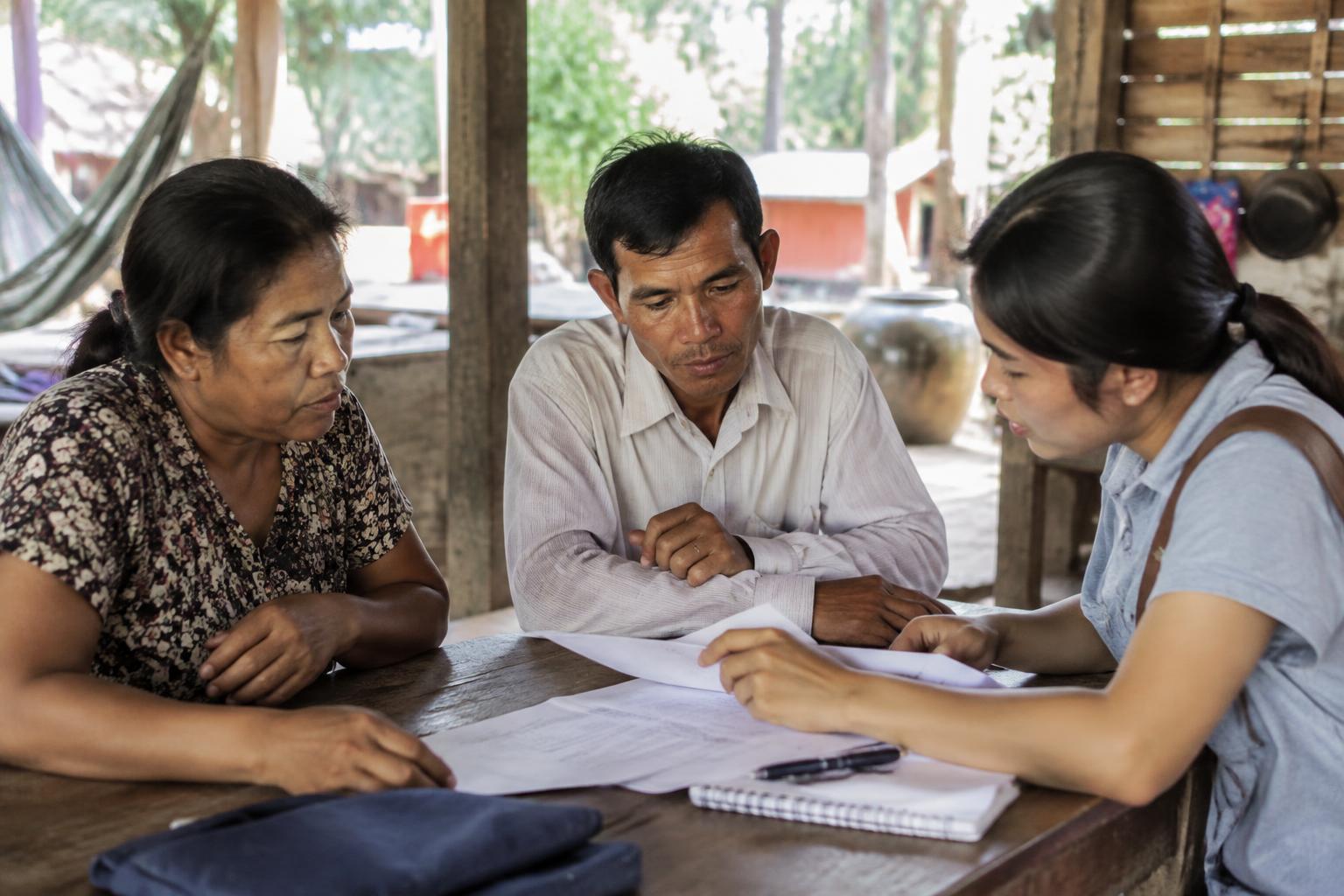 Community members and a field practitioner in a close working conversation